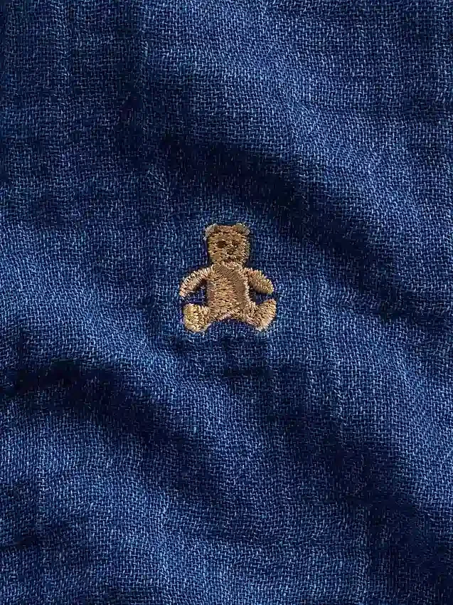 Baby-Einteiler aus Baumwollgaze und Denim