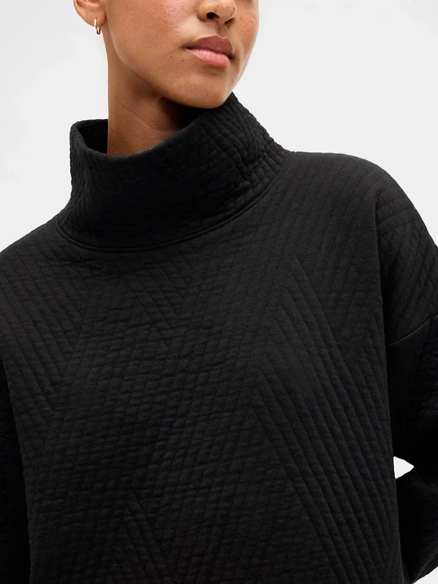 GapFit gesteppter Jacquard-Strickpullover mit Trichterkragen