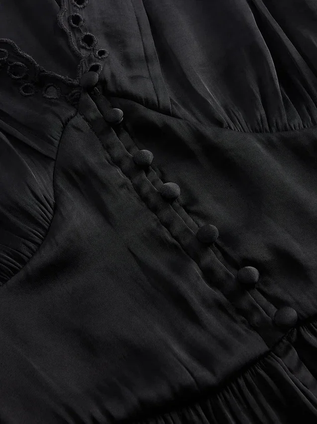 Peplum-Oberteil mit V-Ausschnitt und Lochstickerei