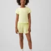 Schnelltrocknende Laufshorts für Kinder mit Schmetterlingssaum