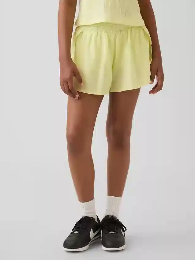 Schnelltrocknende Laufshorts für Kinder mit Schmetterlingssaum