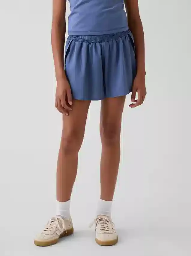 Schnelltrocknende Laufshorts für Kinder mit Schmetterlingssaum