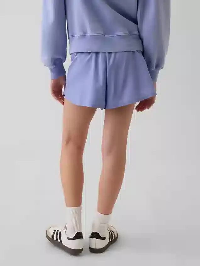 Schnelltrocknende Laufshorts für Kinder mit Schmetterlingssaum