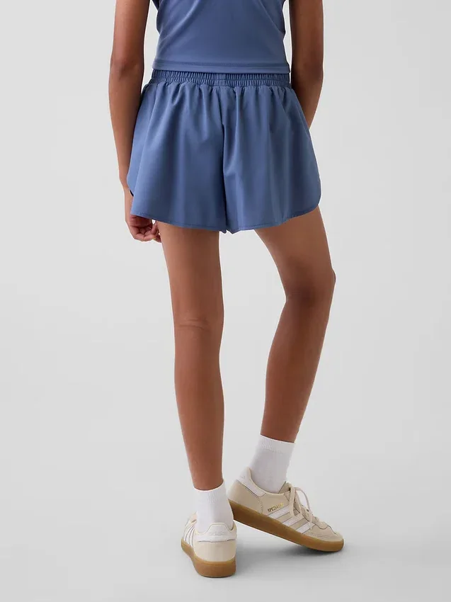 Schnelltrocknende Laufshorts für Kinder mit Schmetterlingssaum