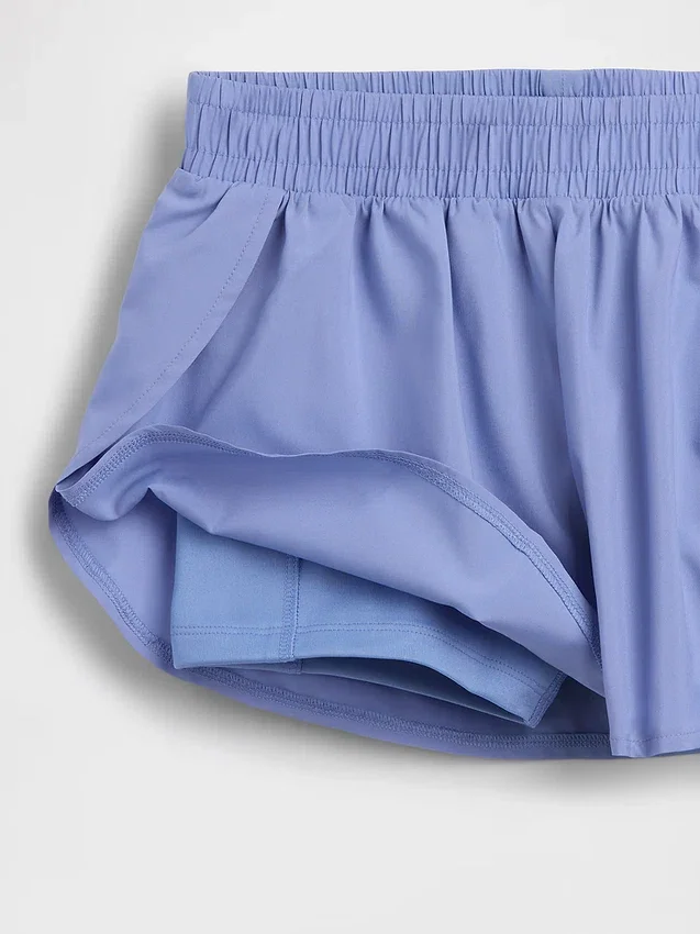 Schnelltrocknende Laufshorts für Kinder mit Schmetterlingssaum